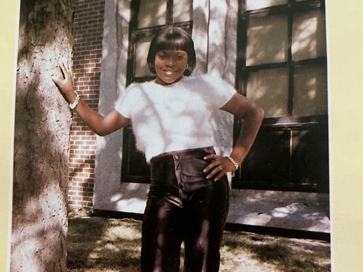A 1996 Kenwood Academy yearbook superlative page: LaGena Cain, Most Sophisticated Female, photographed outside the school.